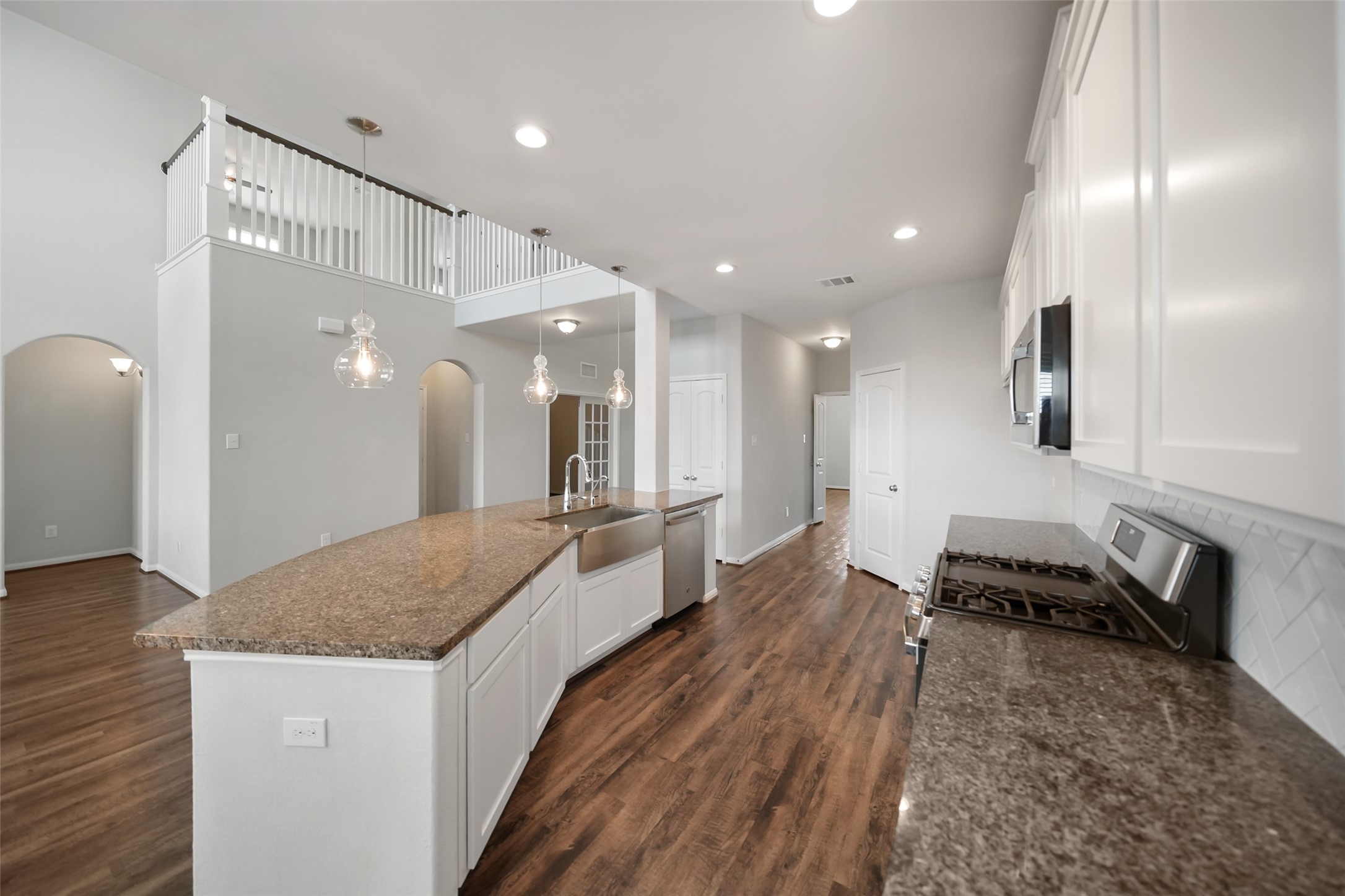234 Ashley Way Alvin, TX 77511 - Photo 13 of 42 Kitchen has hallway in back to laundry and dining rooms.