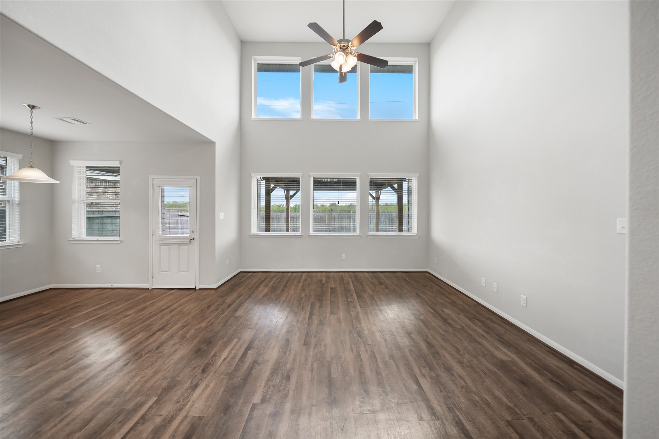 234 Ashley Way Alvin, TX 77511 - Photo 19 of 42 wooden floor in an empty room with a window