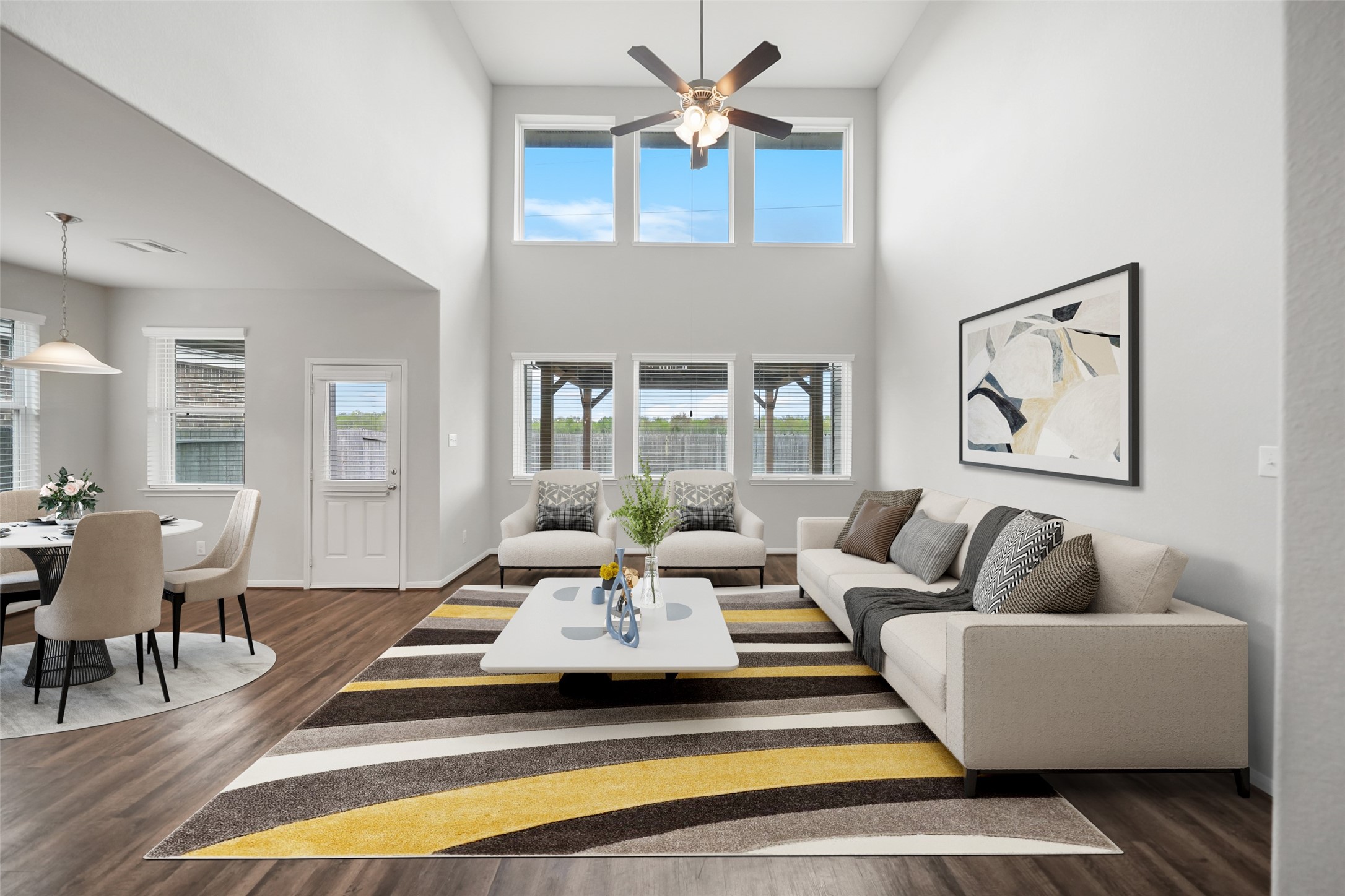 234 Ashley Way Alvin, TX 77511 - Photo 20 of 42 a living room with furniture a rug and a chandelier