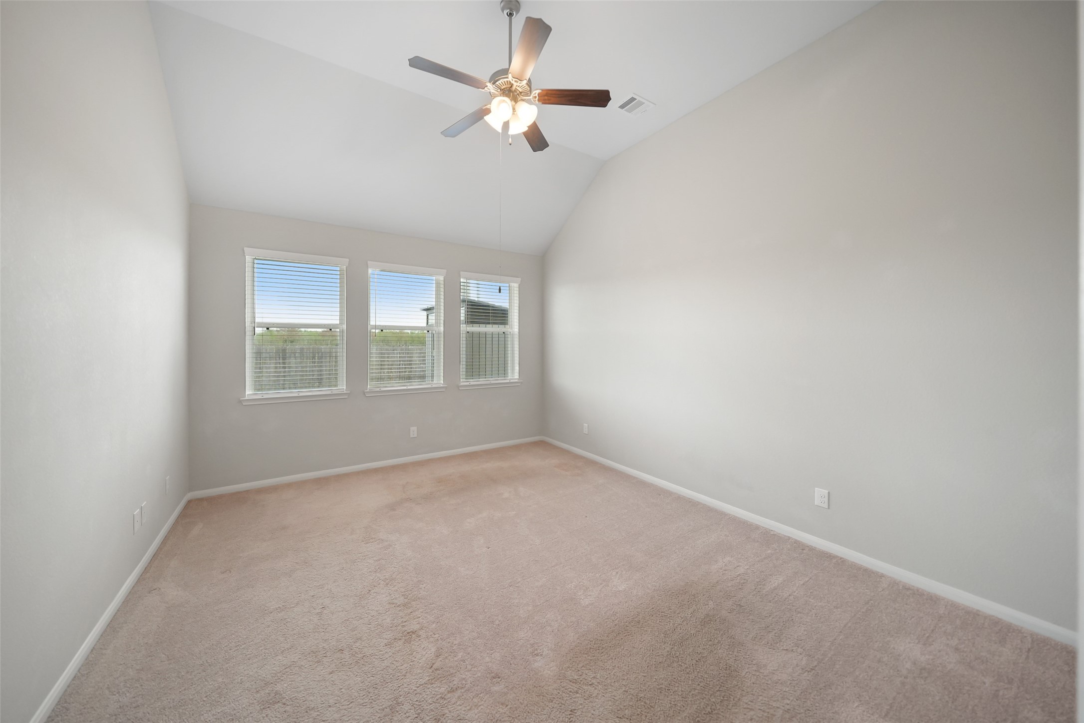 234 Ashley Way Alvin, TX 77511 - Photo 21 of 42 an empty room with a window and a fan