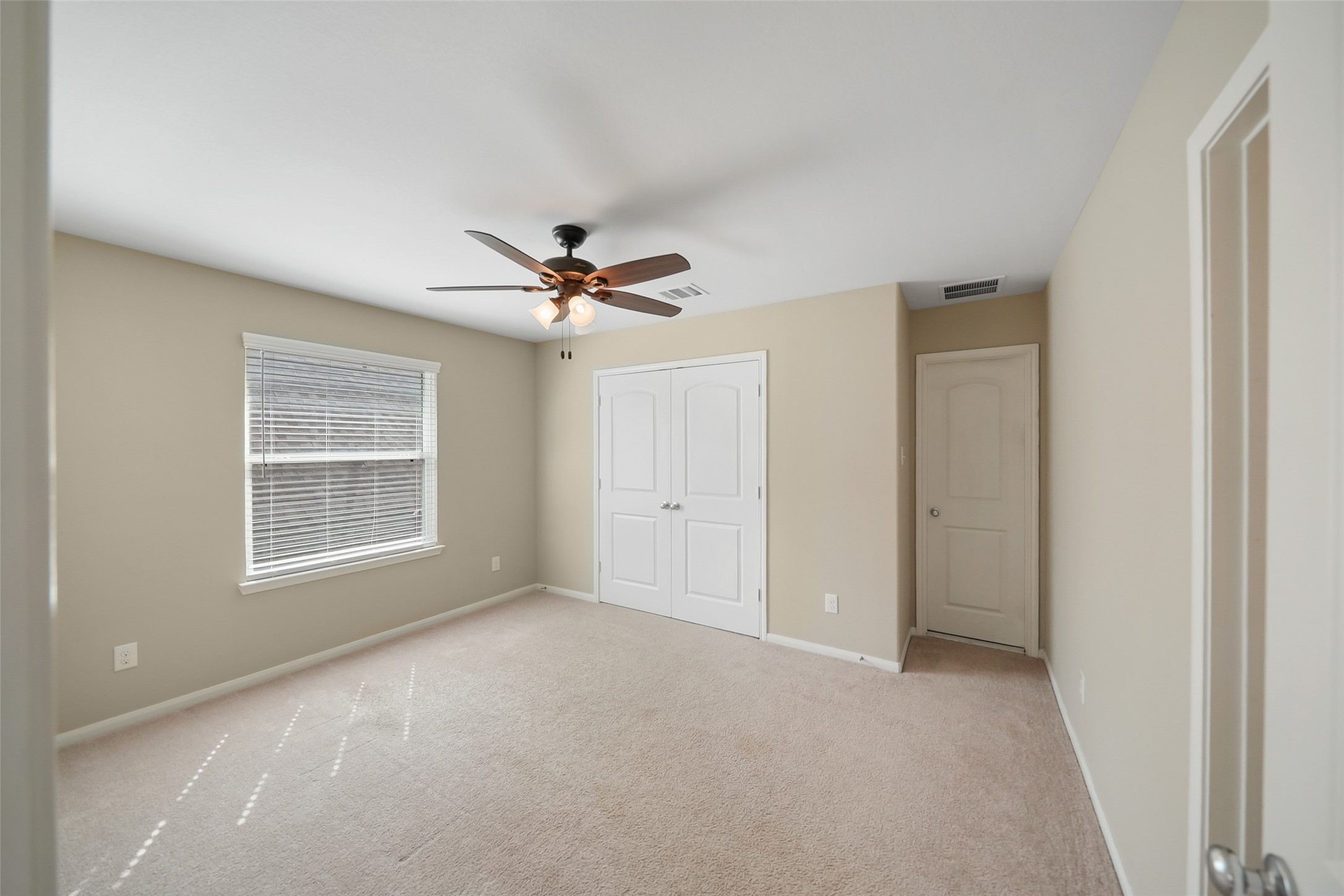 234 Ashley Way Alvin, TX 77511 - Photo 30 of 42 a view of an empty room with a window