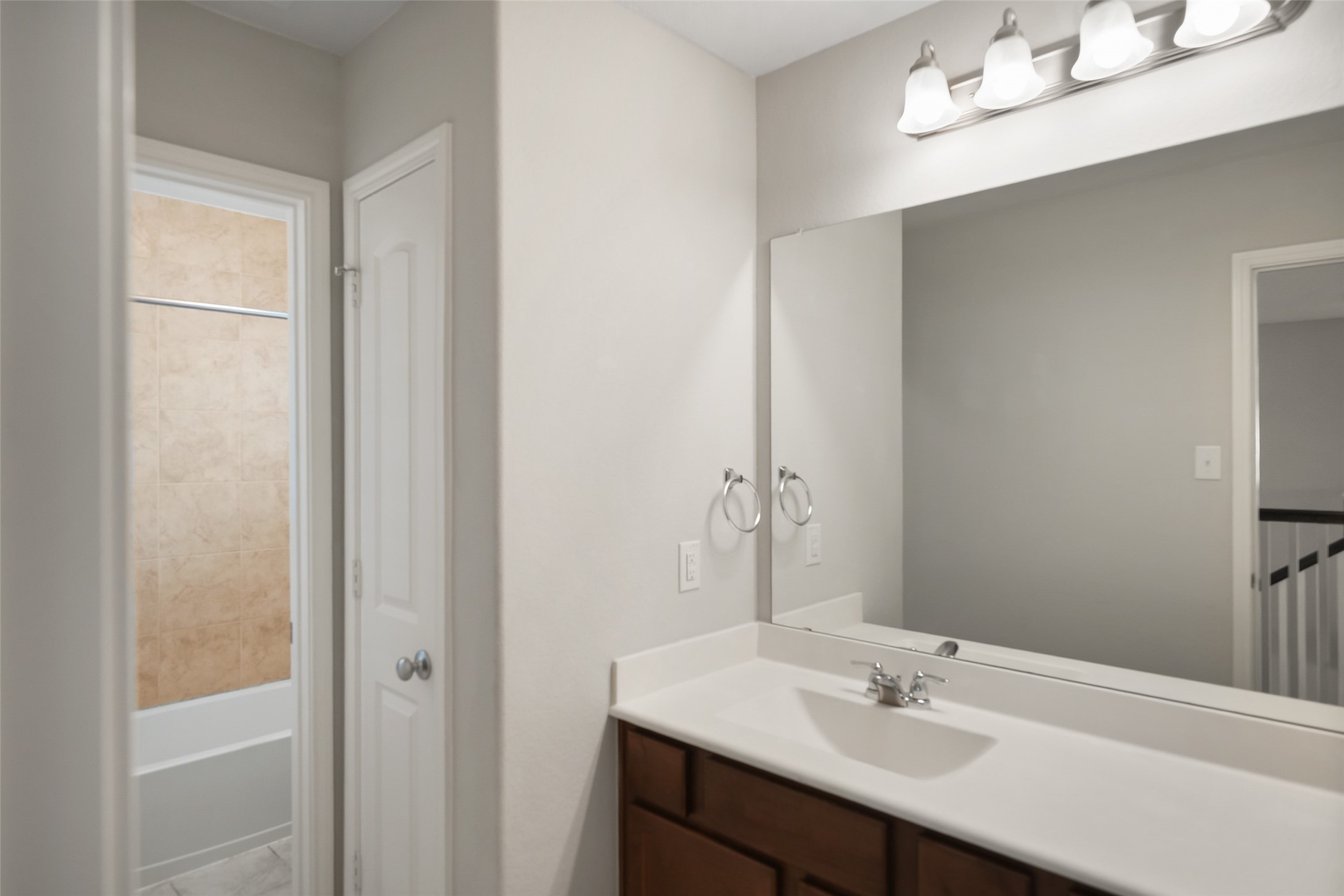 234 Ashley Way Alvin, TX 77511 - Photo 34 of 42 a bathroom with a sink vanity and a mirror