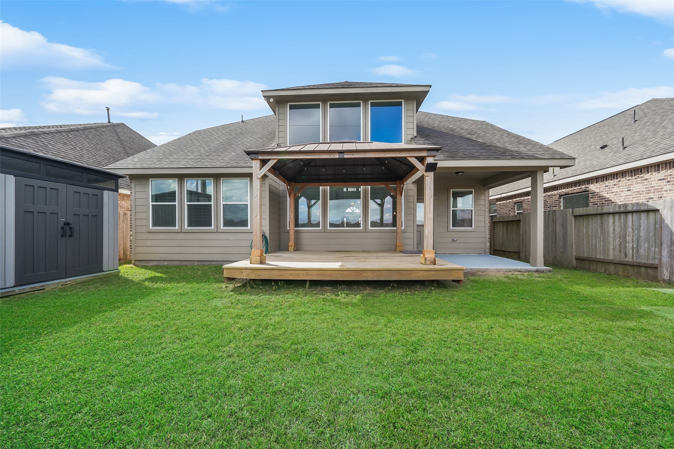 234 Ashley Way Alvin, TX 77511 - Photo 39 of 42 a front view of a house with a garden