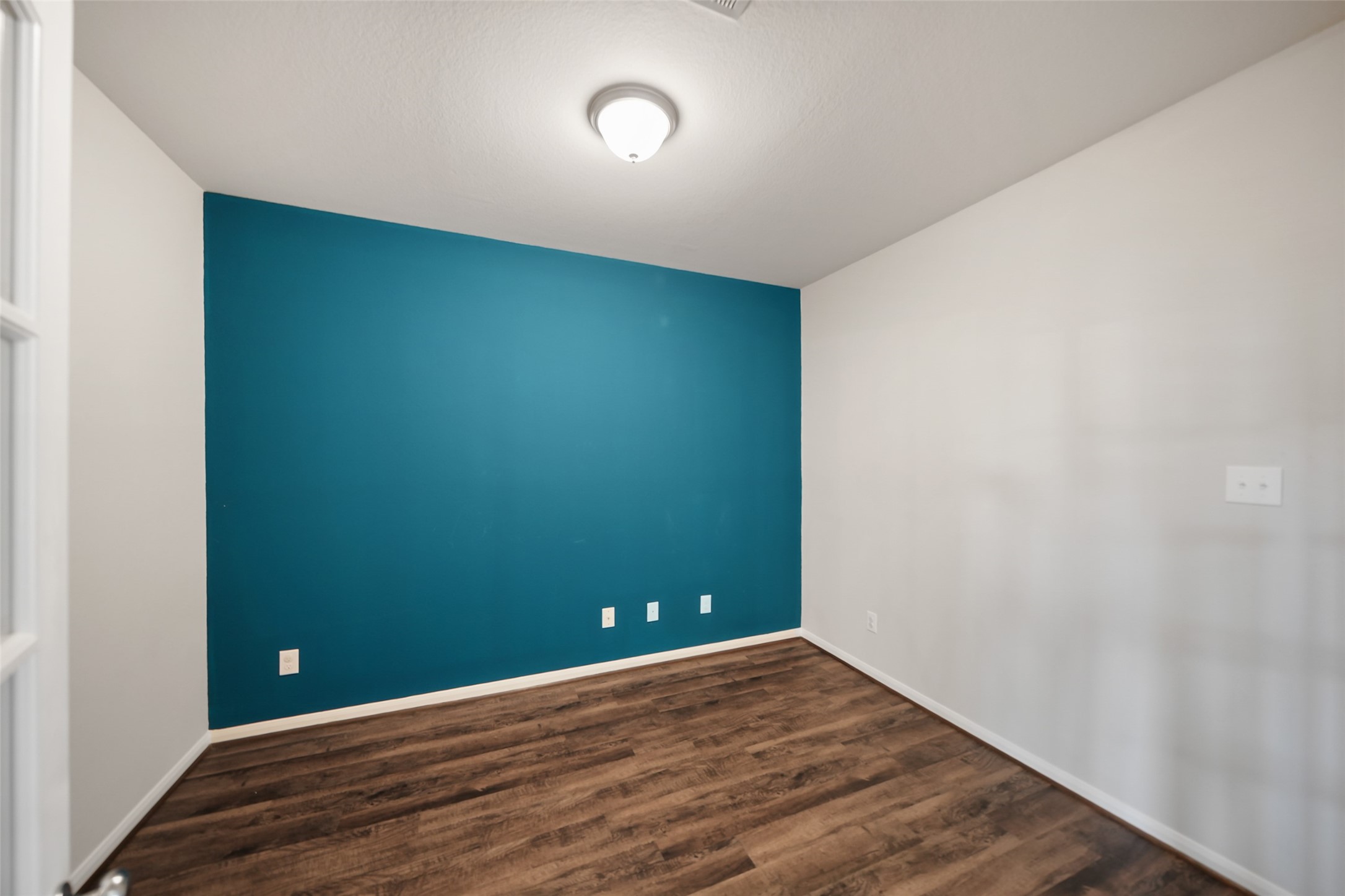 234 Ashley Way Alvin, TX 77511 - Photo 6 of 42 a view of an empty room with wooden floor