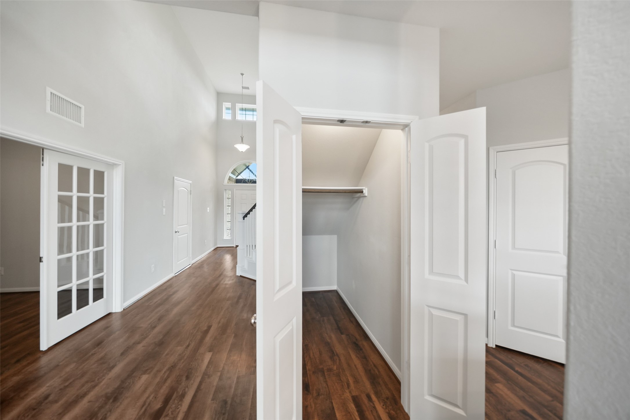 234 Ashley Way Alvin, TX 77511 - Photo 8 of 42 a view of a hallway with wooden floor and staircase