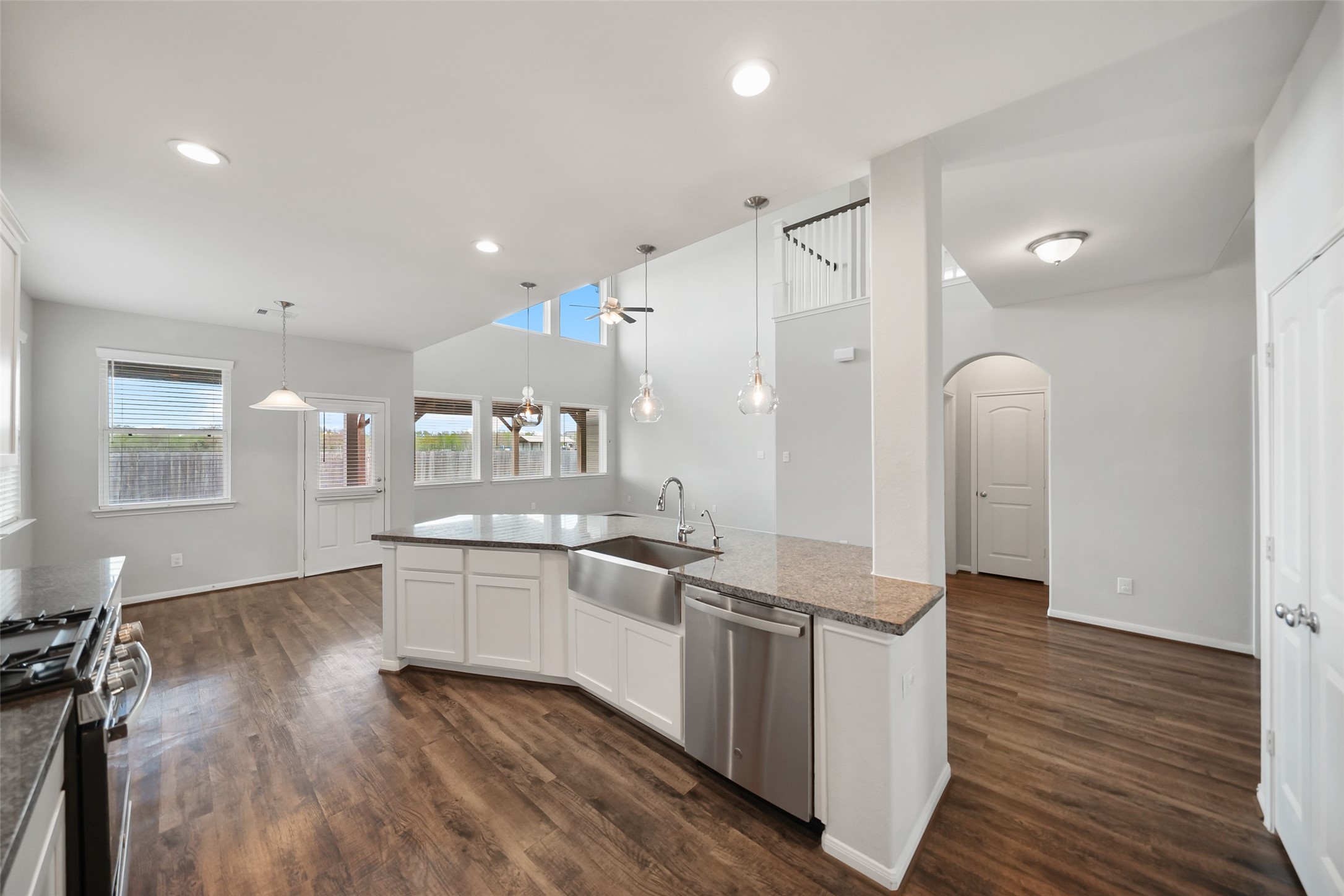 234 Ashley Way Alvin, TX 77511 - Photo 10 of 42 a large kitchen with stainless steel appliances granite countertop a lot of counter space and wooden floor