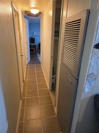 a bathroom with a mirror and a shower