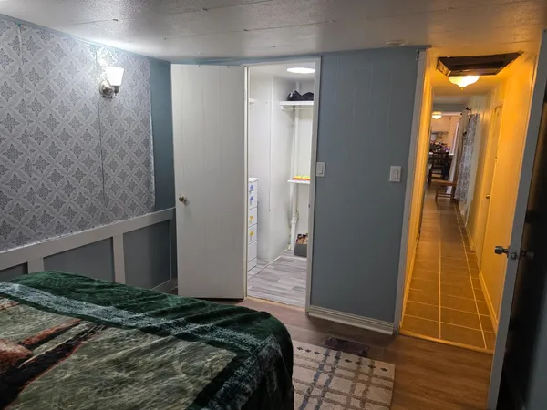 a bedroom with a bed and a shower