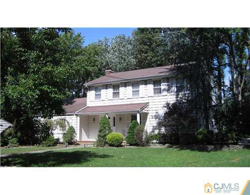 19 Huntington Road Edison, NJ 08820 - Photo 1 of 16 a black and white photo of a house
