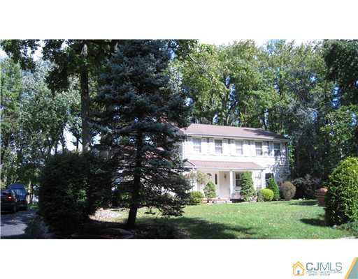 19 Huntington Road Edison, NJ 08820 - Photo 2 of 16 a black and white photo of a house
