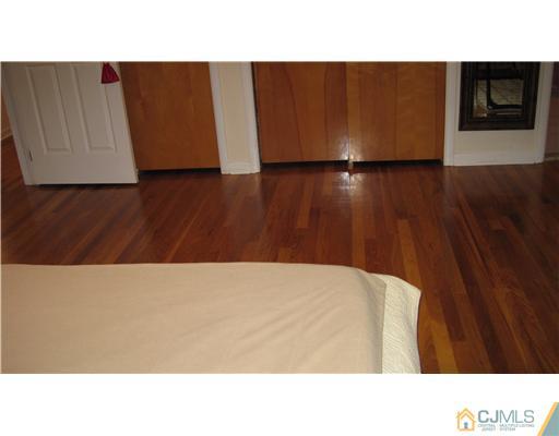 19 Huntington Road Edison, NJ 08820 - Photo 15 of 16 a open kitchen with a white car parked in front of it