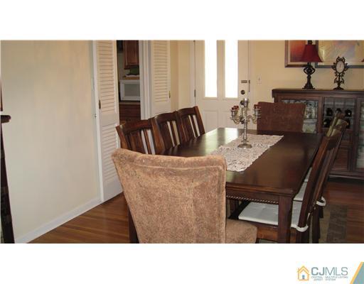 19 Huntington Road Edison, NJ 08820 - Photo 9 of 16 a kitchen with a table and chairs