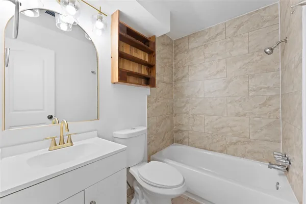 a en suite bathroom with a sink double vanity and a mirror