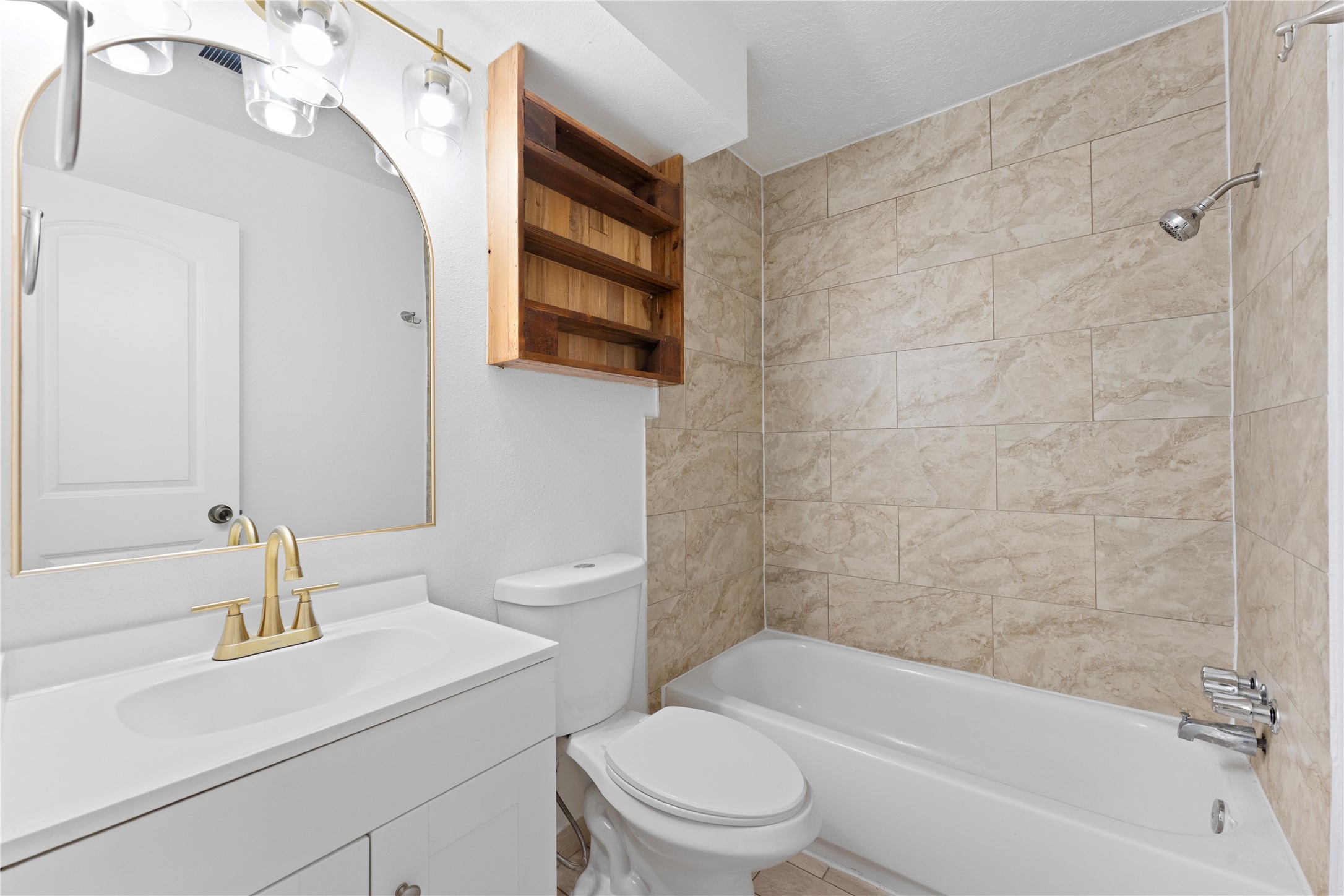 1411 PI Circle Pasadena, TX 77504 - Photo 18 of 26 a bathroom with a sink a toilet and shower