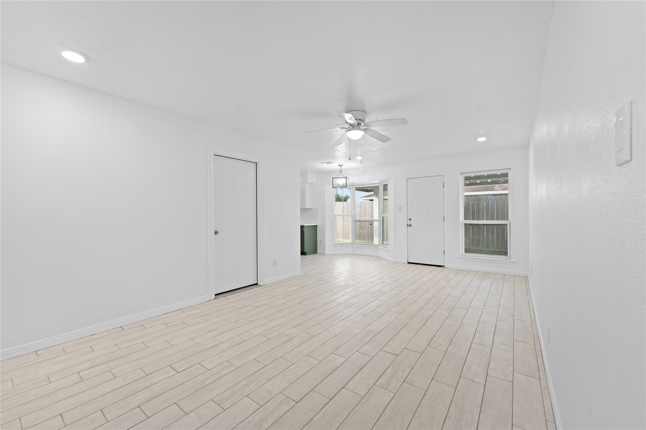 1411 PI Circle Pasadena, TX 77504 - Photo 21 of 26 wooden floor in an empty room with a window