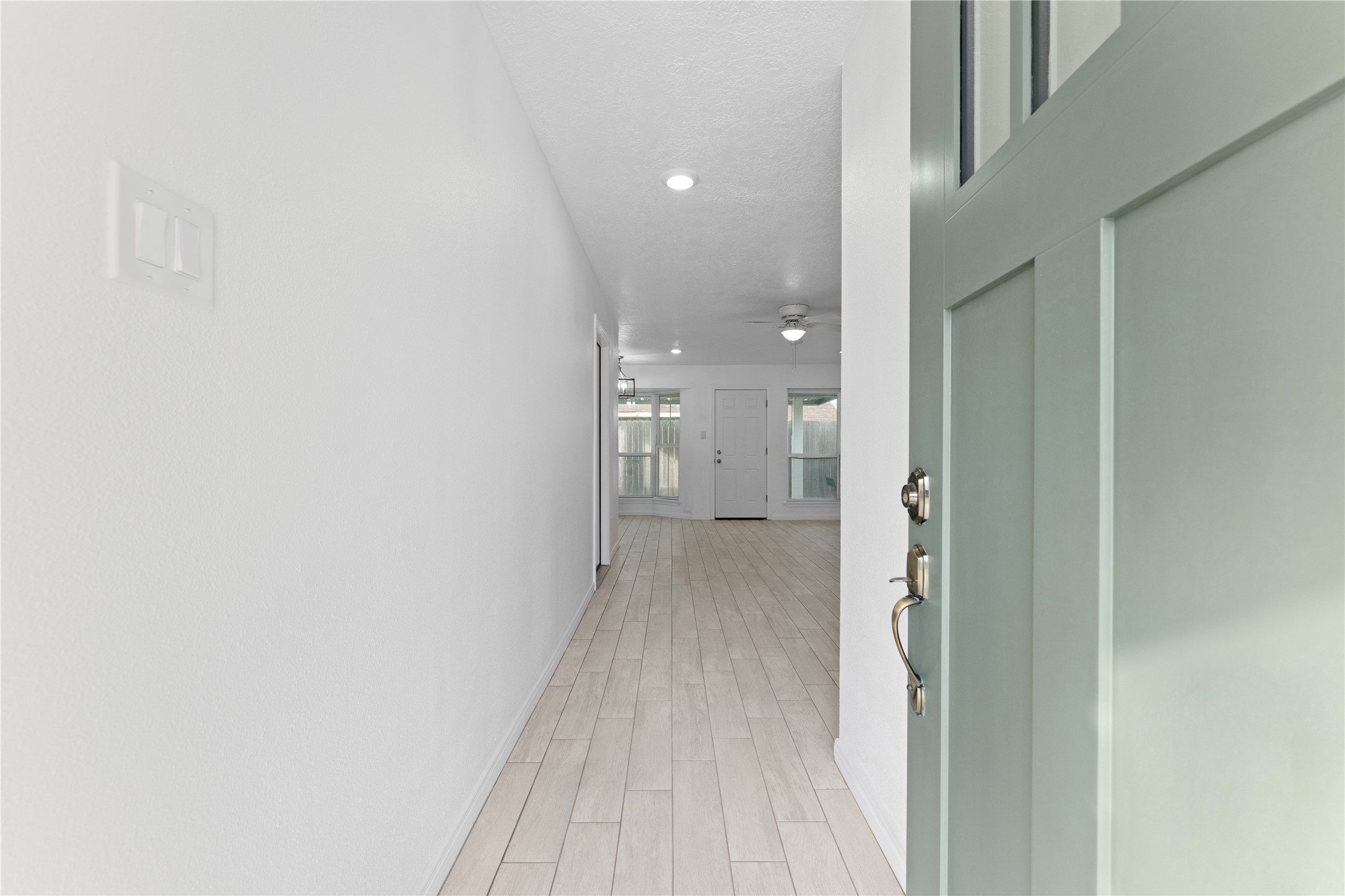 1411 PI Circle Pasadena, TX 77504 - Photo 5 of 26 a view of a hallway with wooden floor