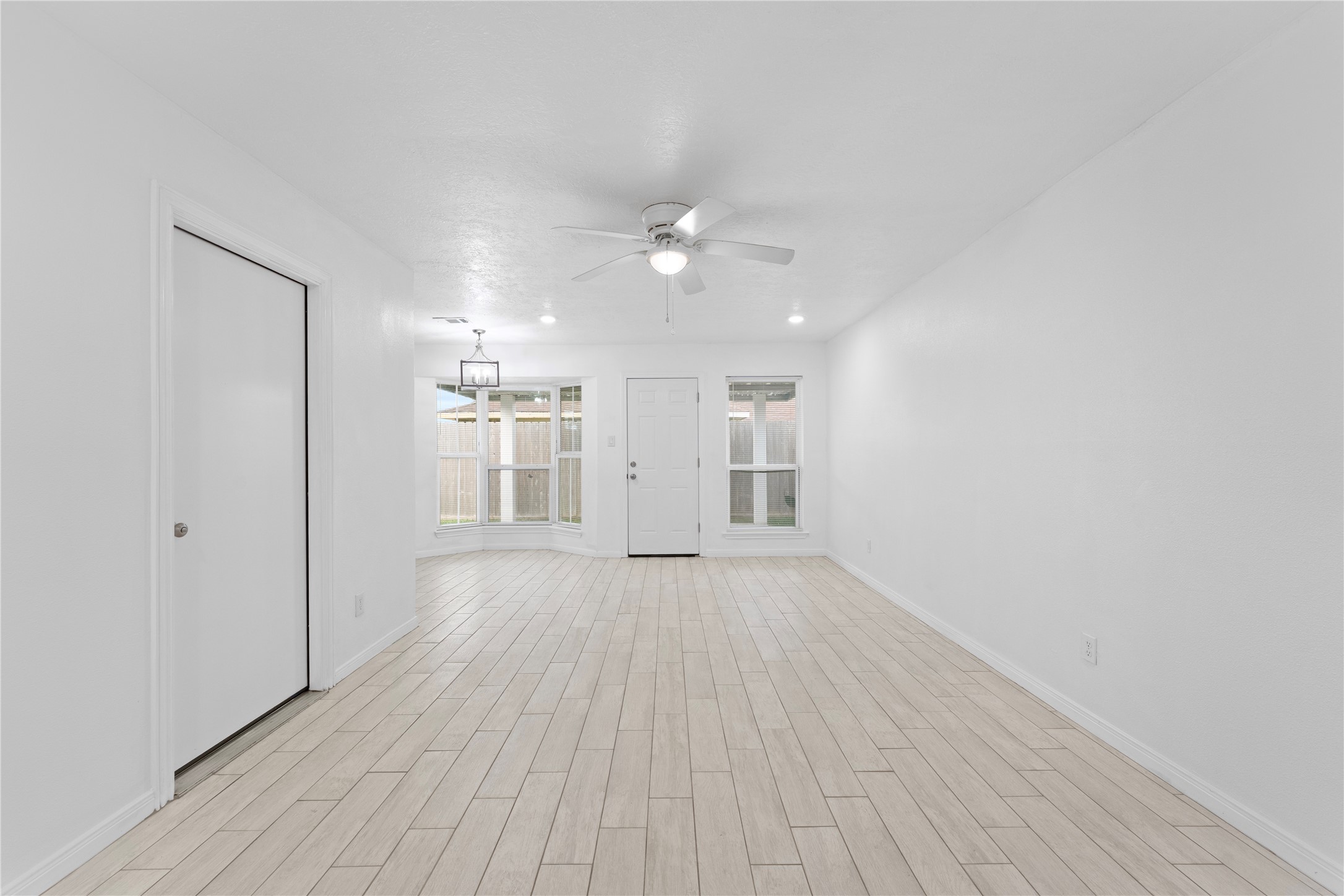 1411 PI Circle Pasadena, TX 77504 - Photo 6 of 26 wooden floor in an empty room with a window