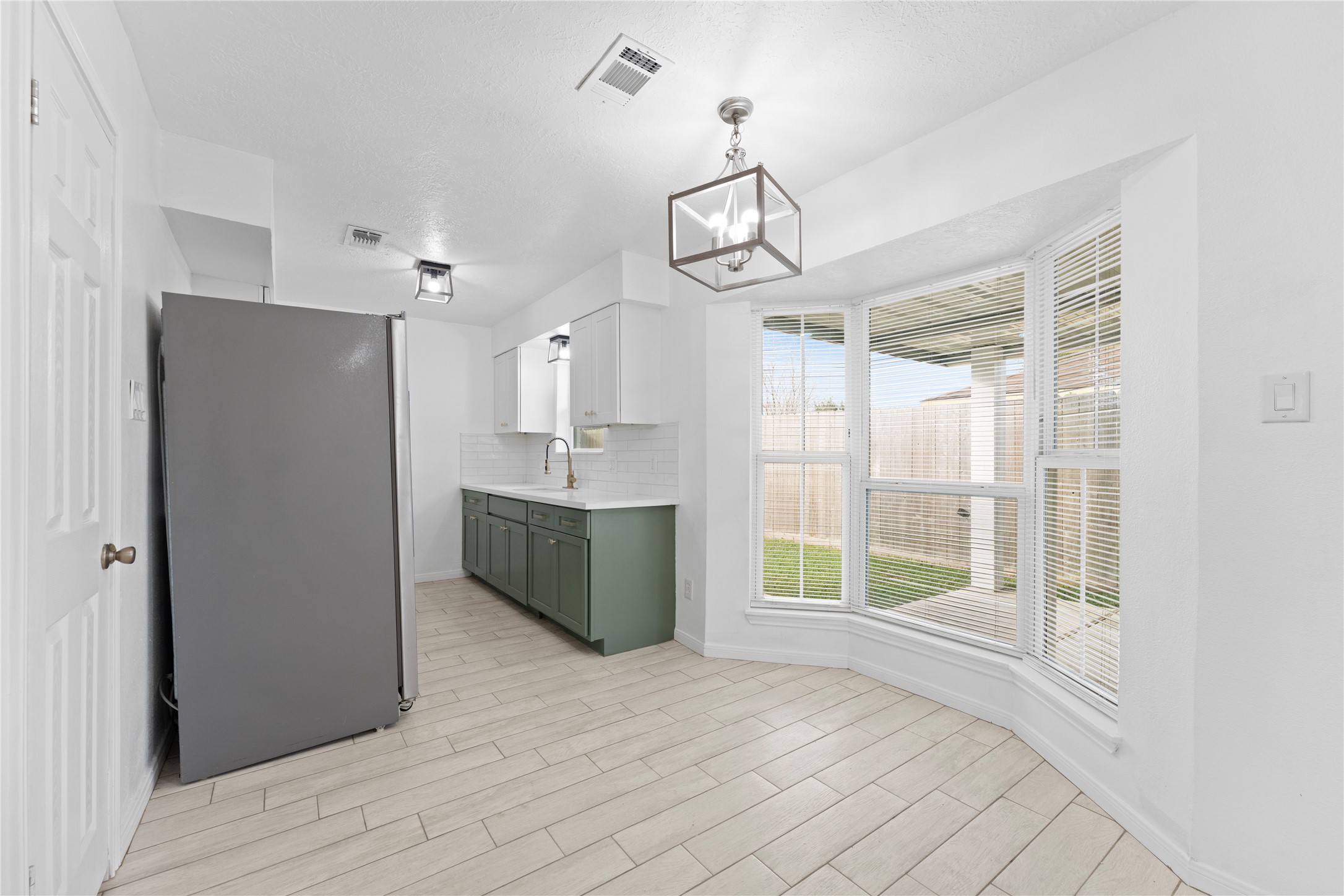 1411 PI Circle Pasadena, TX 77504 - Photo 9 of 26 a view of empty room with wooden floor and fan