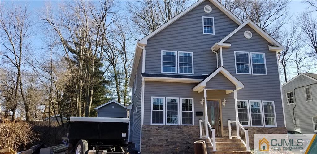 171 East Cliff Road Colonia, NJ 07067 - Photo 1 of 25 a front view of a house with a yard