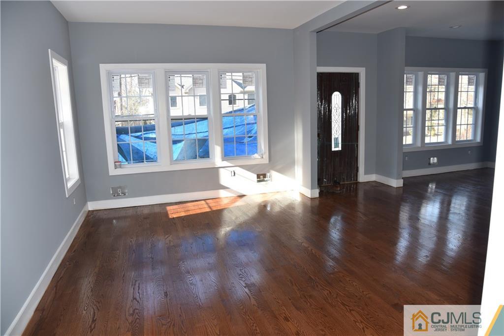 171 East Cliff Road Colonia, NJ 07067 - Photo 2 of 25 a view of livingroom with hardwood floor and window