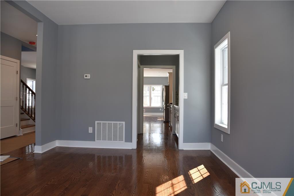 171 East Cliff Road Colonia, NJ 07067 - Photo 20 of 25 a view of livingroom with hardwood floor and hallway
