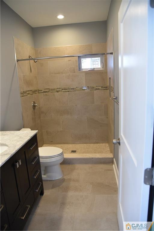 171 East Cliff Road Colonia, NJ 07067 - Photo 22 of 25 a bathroom with a granite countertop sink toilet and shower