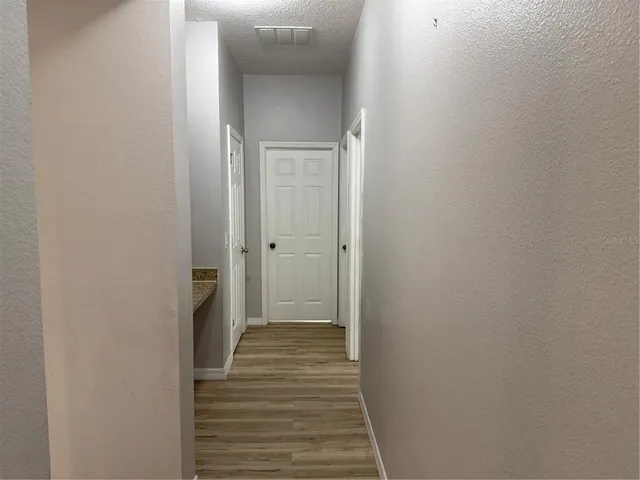 a view of a bathroom from the hallway