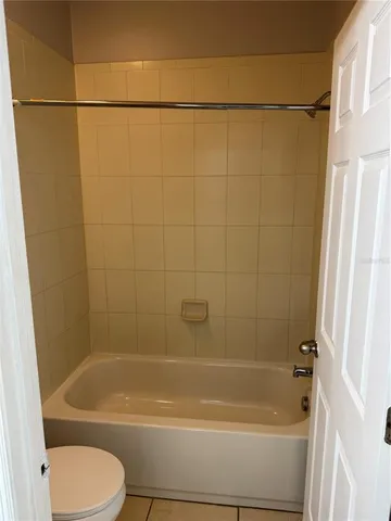 a bathroom with a shower and a toilet