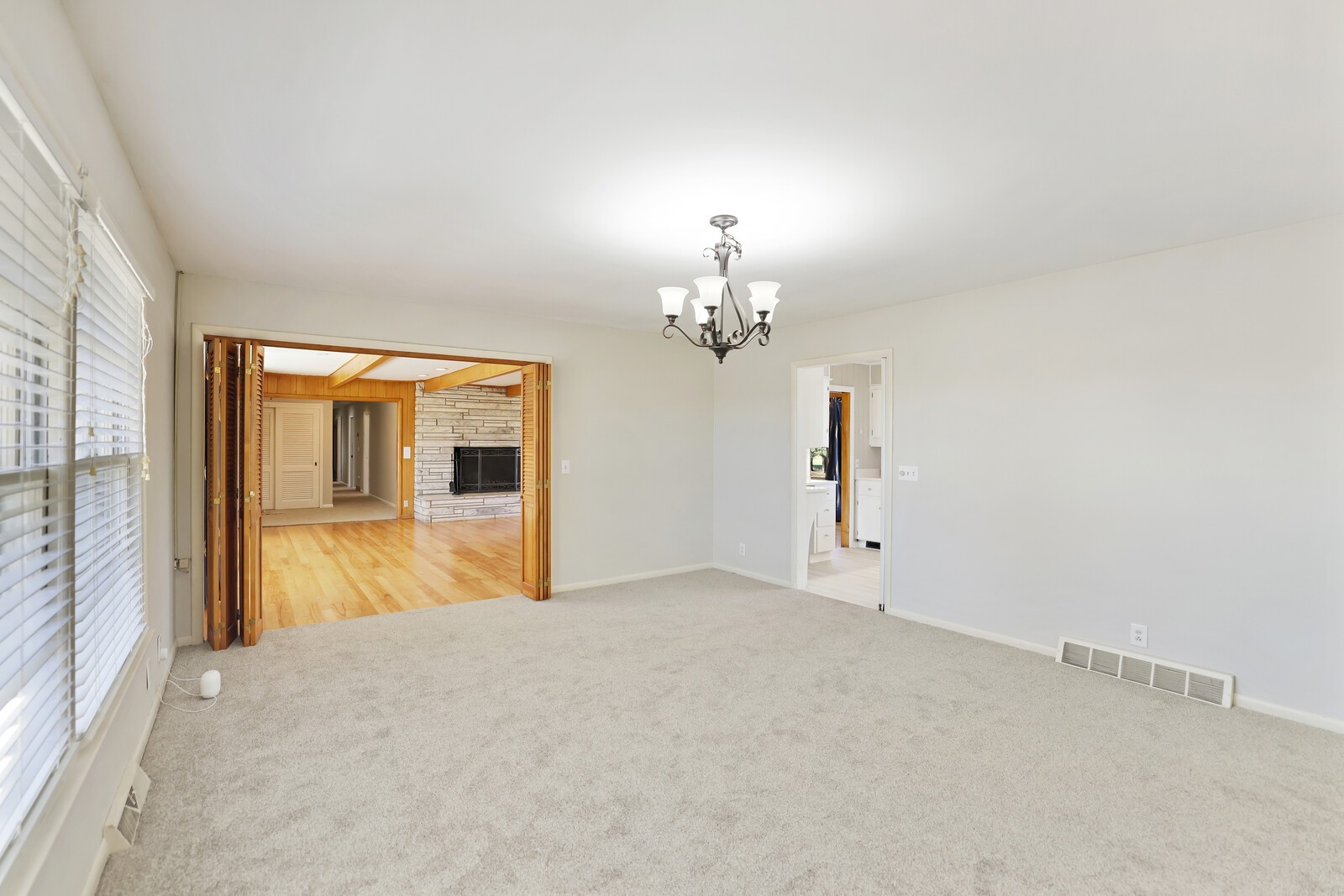 676 Ferguson Hill Road Lafayette, TN 37083 - Photo 12 of 89 a view of a room with a chandelier fan and windows