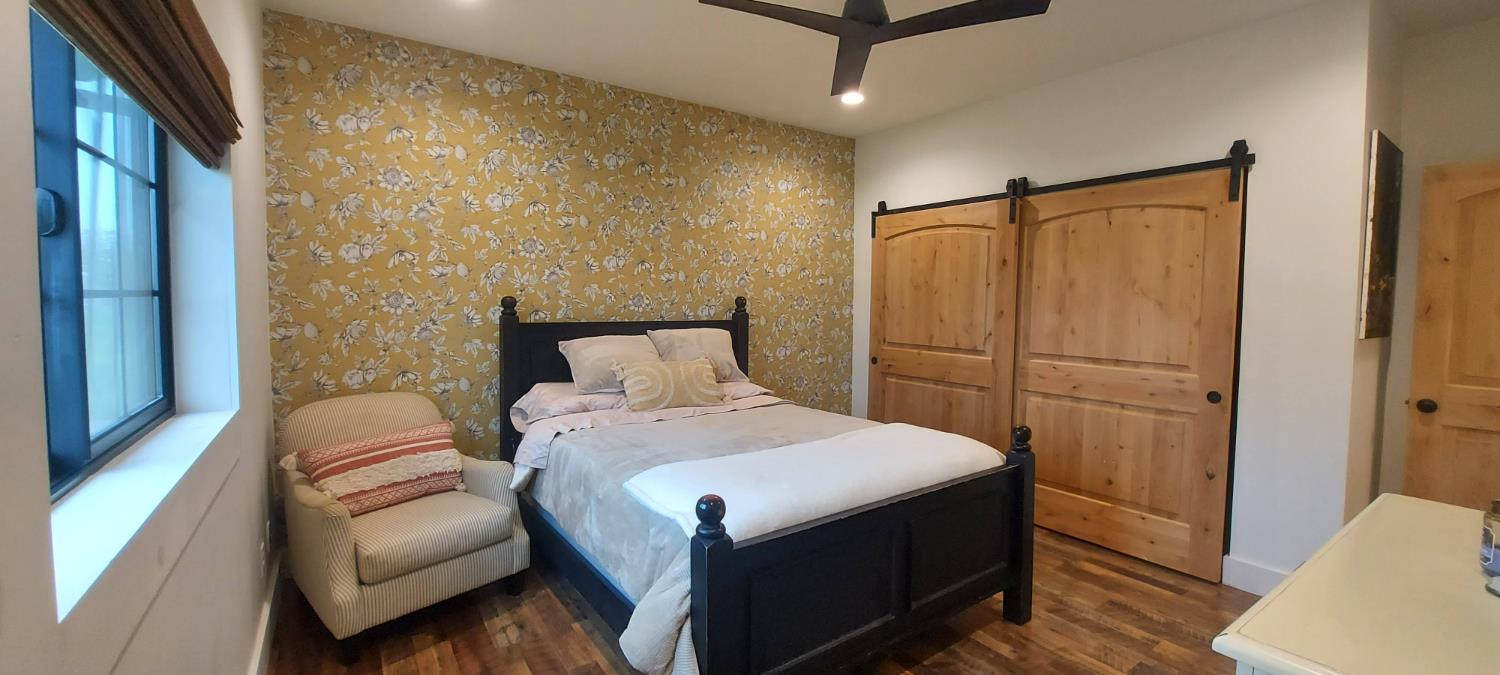 1102 Barry Road Yuba City, CA 95991 - Photo 25 of 72 a bedroom with a bed and a couch