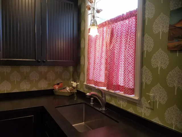 a bedroom with a bed and a mirror