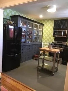 a view of a porch with wooden floor