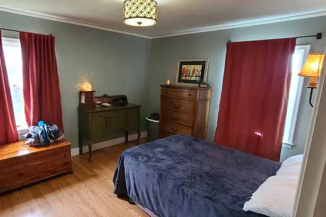 a room that has a bed and a window