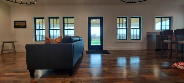 a living room with furniture and a window