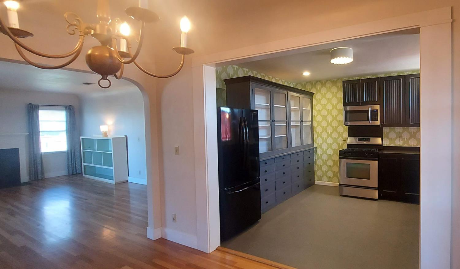 1102 Barry Road Yuba City, CA 95991 - Photo 57 of 72 a kitchen with cabinets and wooden floor