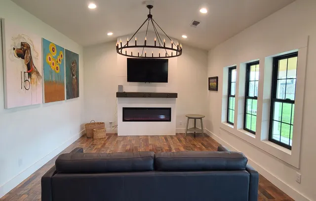 a living room with furniture and a fireplace