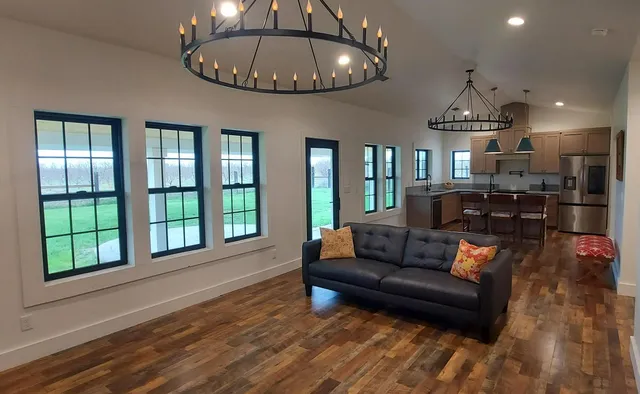 a kitchen with stainless steel appliances granite countertop a sink and a refrigerator