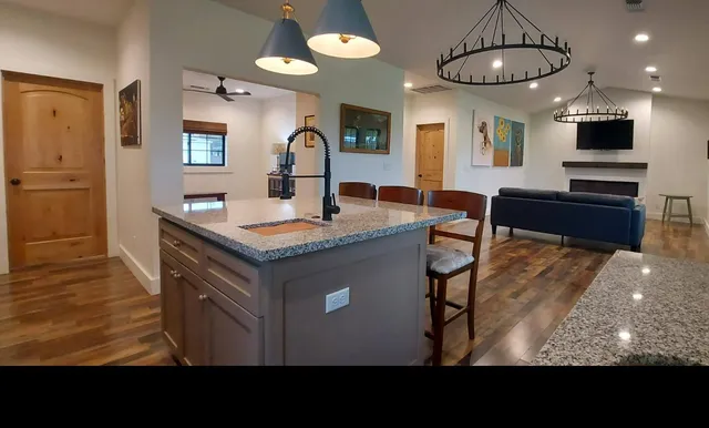 a kitchen with lots of counter top space and a window