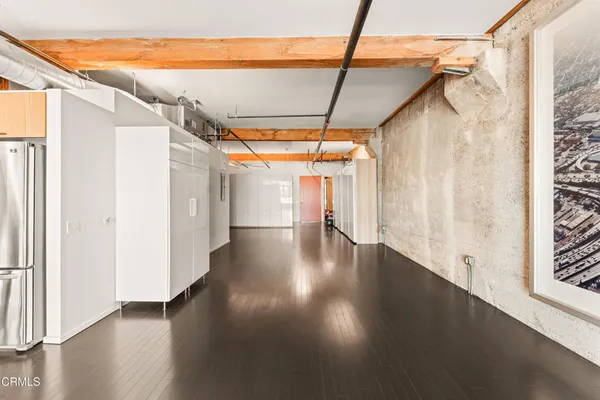 a view of a porch with wooden floor and windows