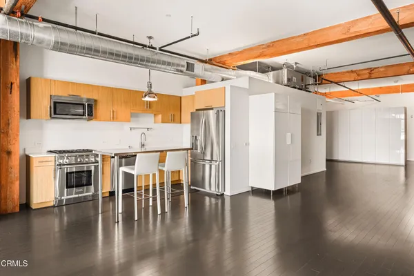 a view of a livingroom with wooden floor