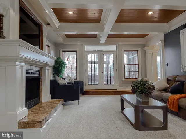 a view of a livingroom with furniture and a window