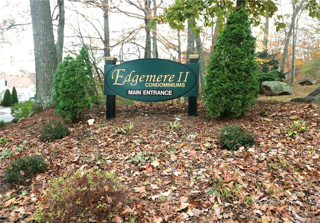 85 North Main Street, Unit 39 East Hampton, CT 06424 - Photo 1 of 1 a sign that is sitting in front of a tree