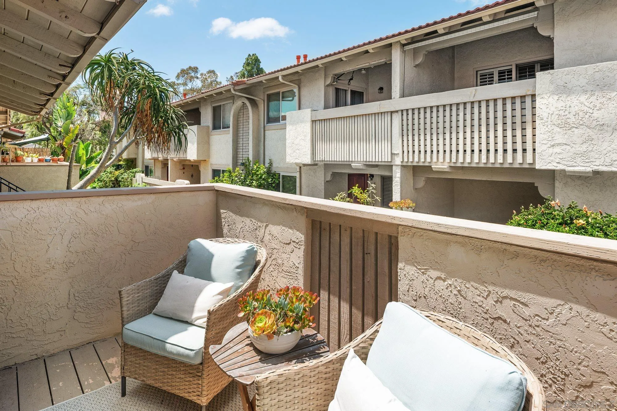 2352 Altisma Way, Unit 15 Carlsbad, CA 92009 - Photo 18 of 42 a view of a chair and table in the balcony