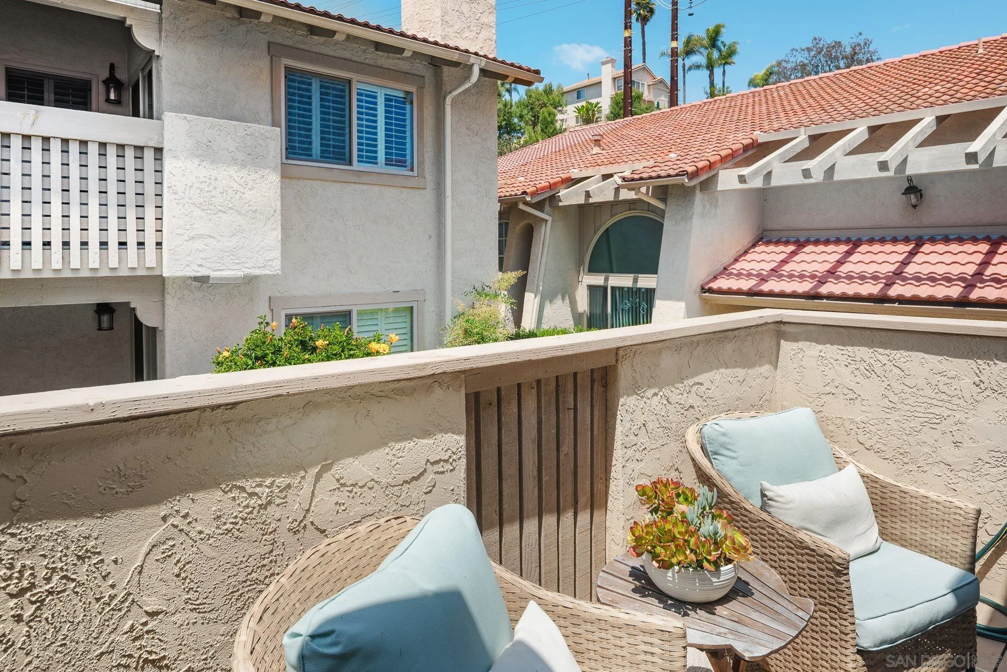2352 Altisma Way, Unit 15 Carlsbad, CA 92009 - Photo 19 of 42 a view of a patio with couches chairs and potted plants