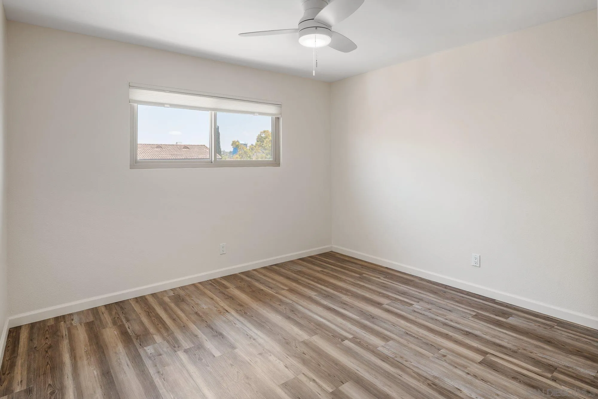 2352 Altisma Way, Unit 15 Carlsbad, CA 92009 - Photo 30 of 42 an empty room with a window