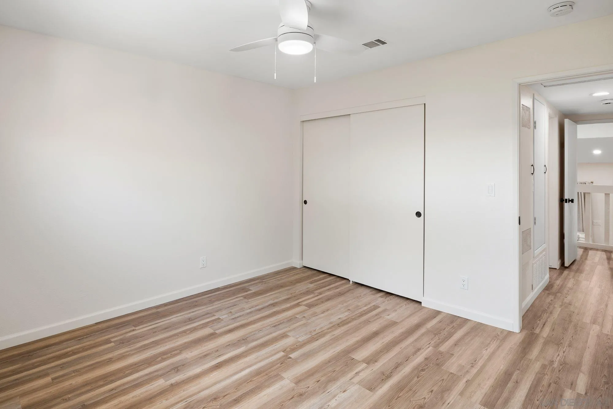 2352 Altisma Way, Unit 15 Carlsbad, CA 92009 - Photo 31 of 42 wooden floor in an empty room