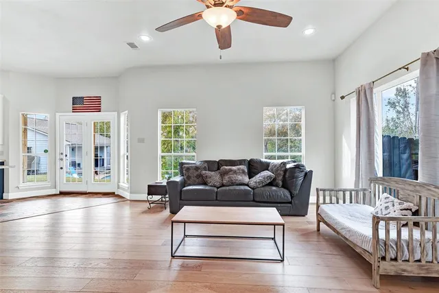 a living room with furniture and a large window
