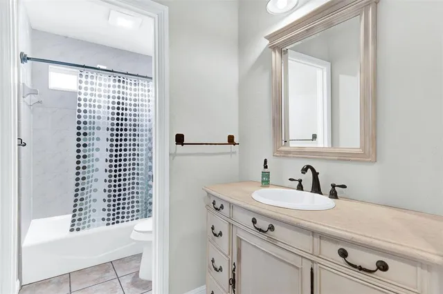 a bathroom with a sink a vanity and a mirror