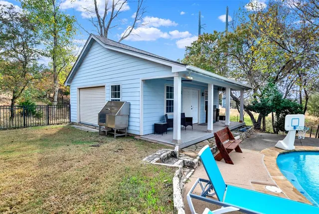 a view of a backyard with a patio