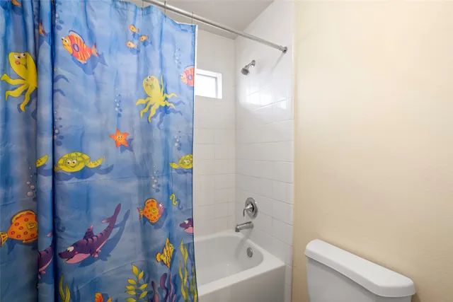 a bathroom with a sink mirror vanity and toilet